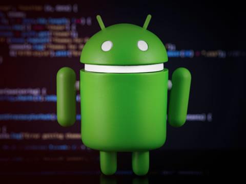 Green Android mascot over a computer screen.